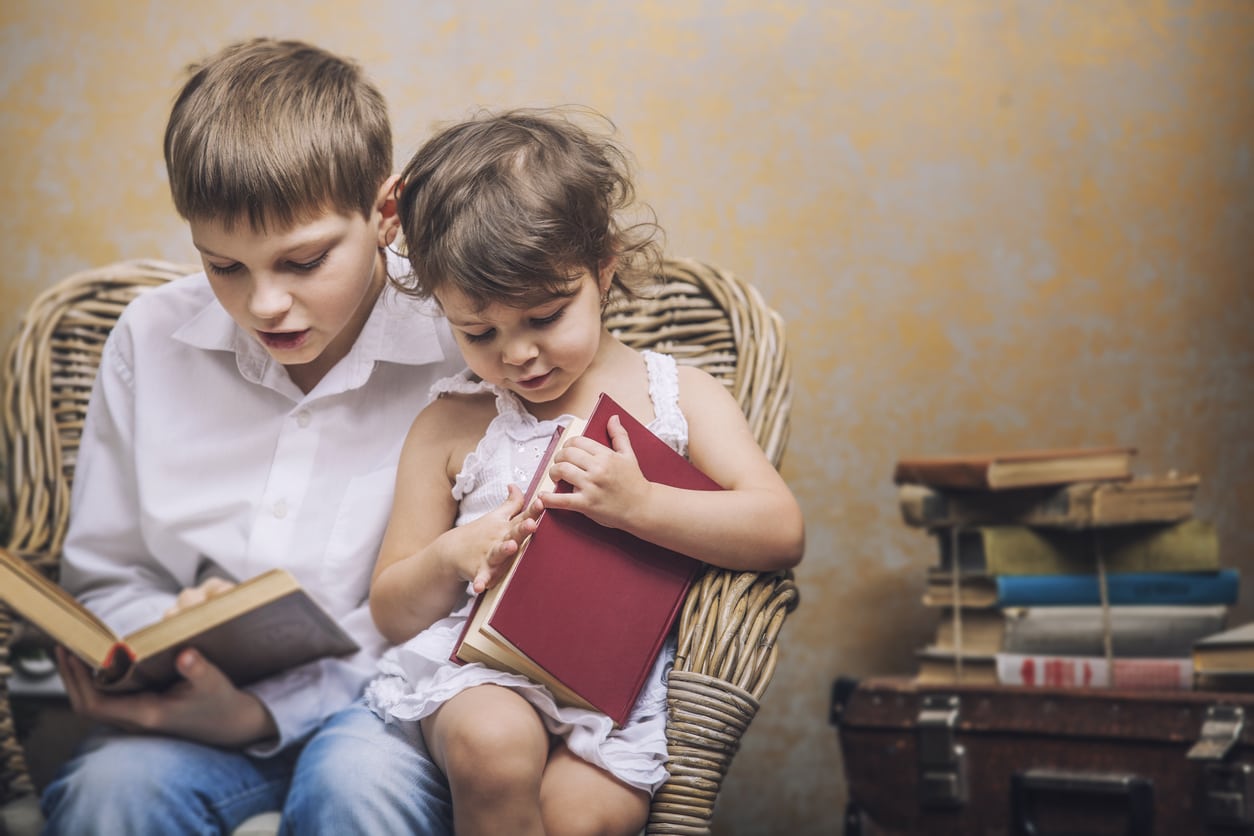 Two children reading books