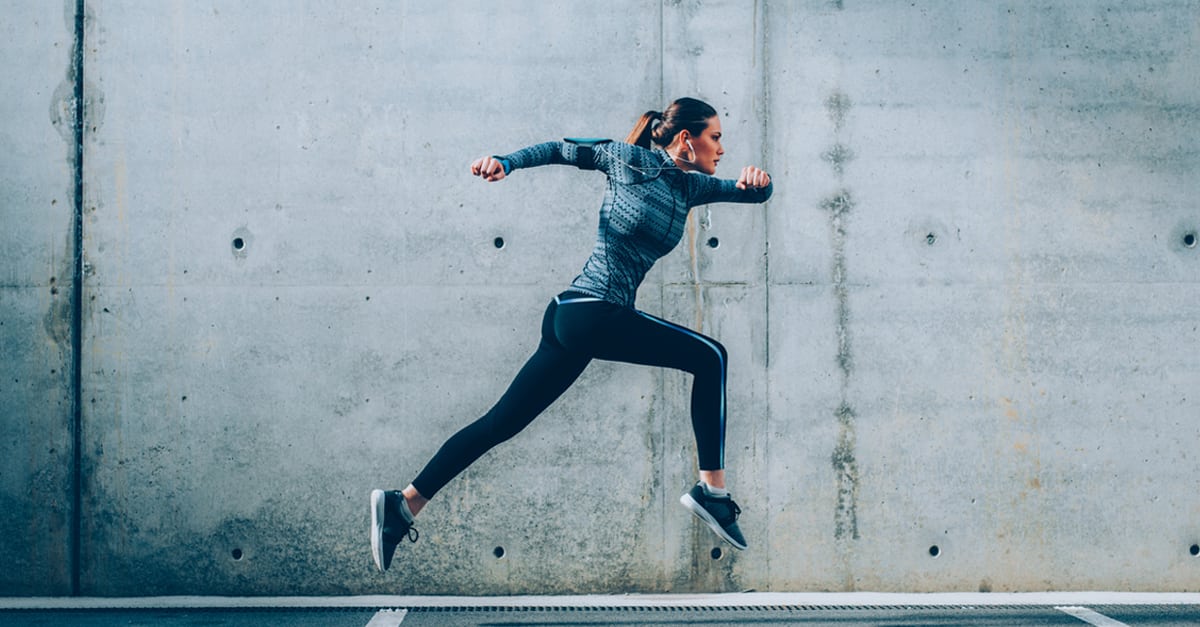 Woman doing an obstacle course to indicate a challenge