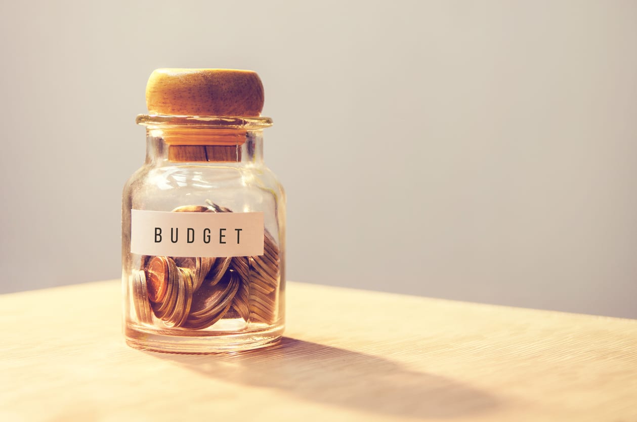 A jar with coins labelled budget