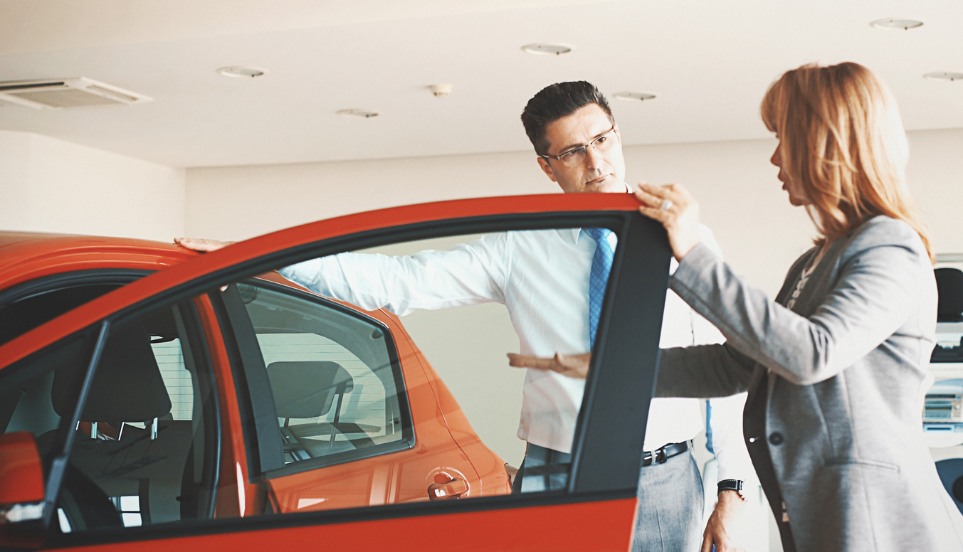 Man car shopping with sales person