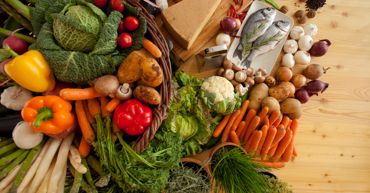 A basket of fresh vegetables and fish