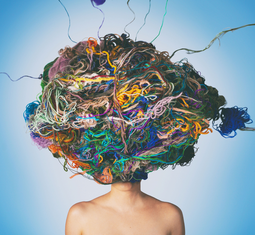 Conceptual photo compilation of woman with tangled threads and wool on head. Tangled situation concept to show clutter.