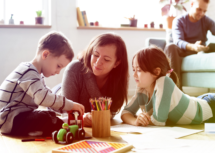 Two children and mom doing crafts