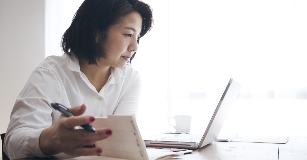 Woman working on personal finance at laptop