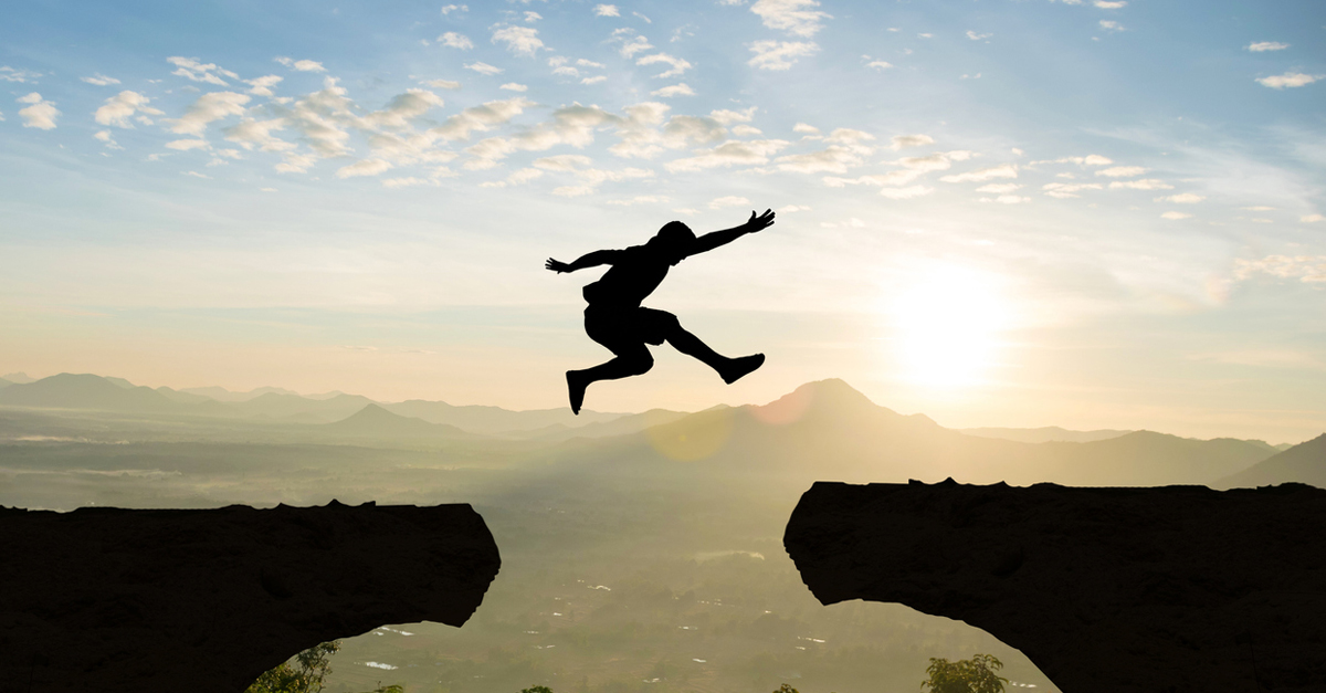 Man leaping over obstacle