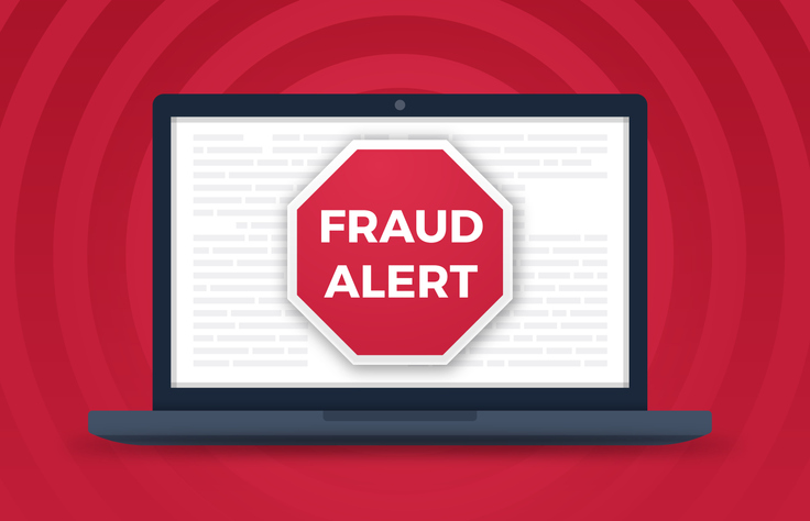 fraud alert message on laptop