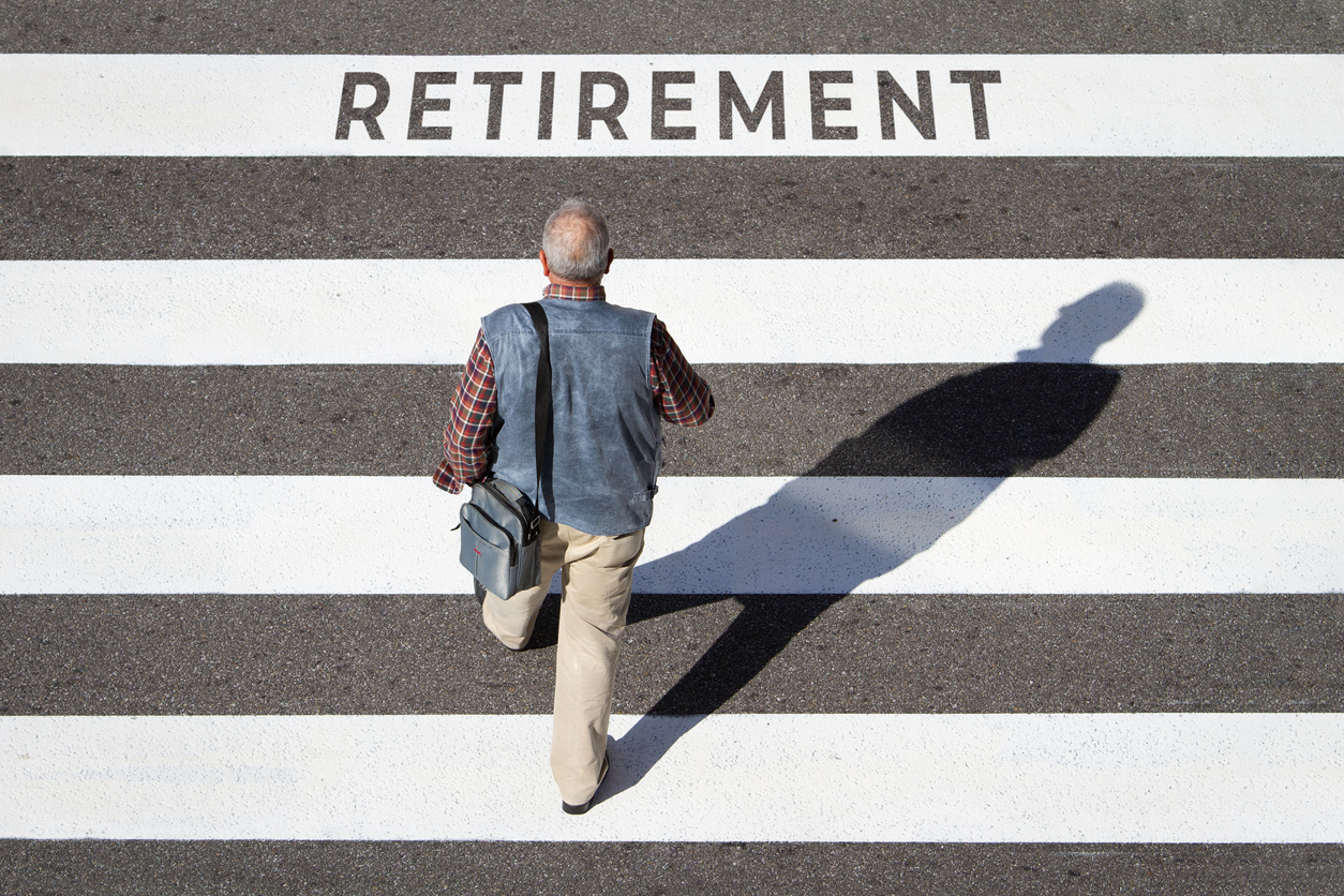 man walking on sidewalk with the words retirement written on it
